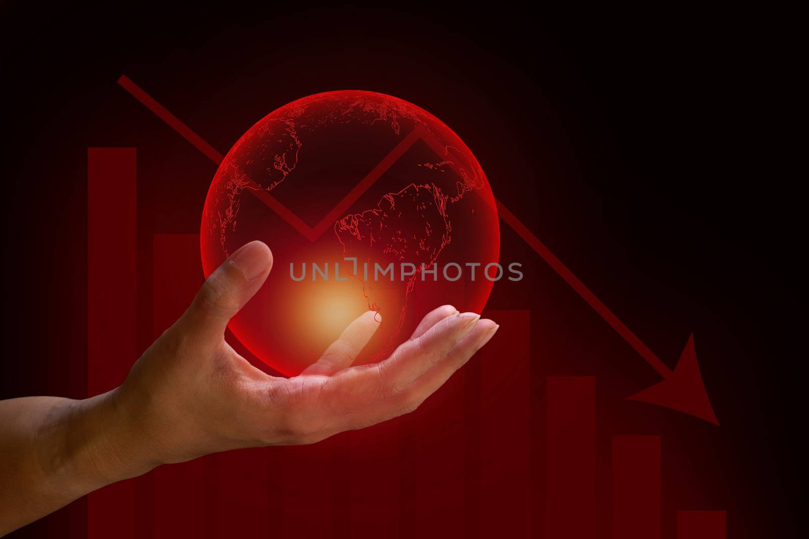 Global financial crisis concept. Human hand hold transparent red earth with graph drop arrow down on red and dark background. 