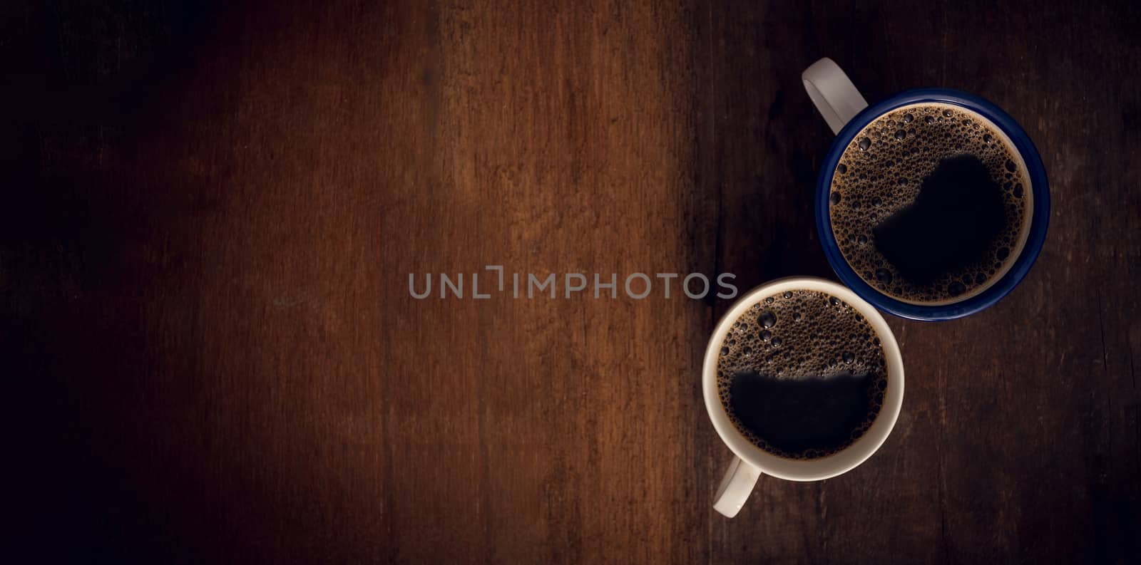 Cup of coffee on wooden background. Copy space. Top view. Flat lay. Panorama
