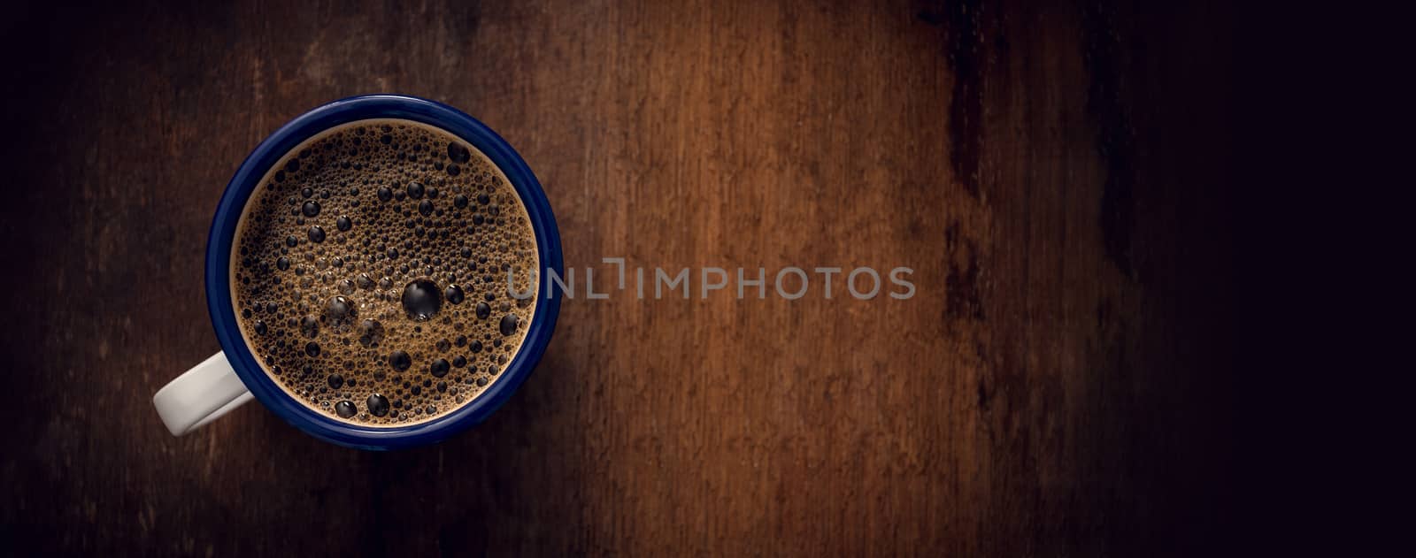 Cup of coffee on wooden background. Copy space. Top view. Flat lay. Panorama