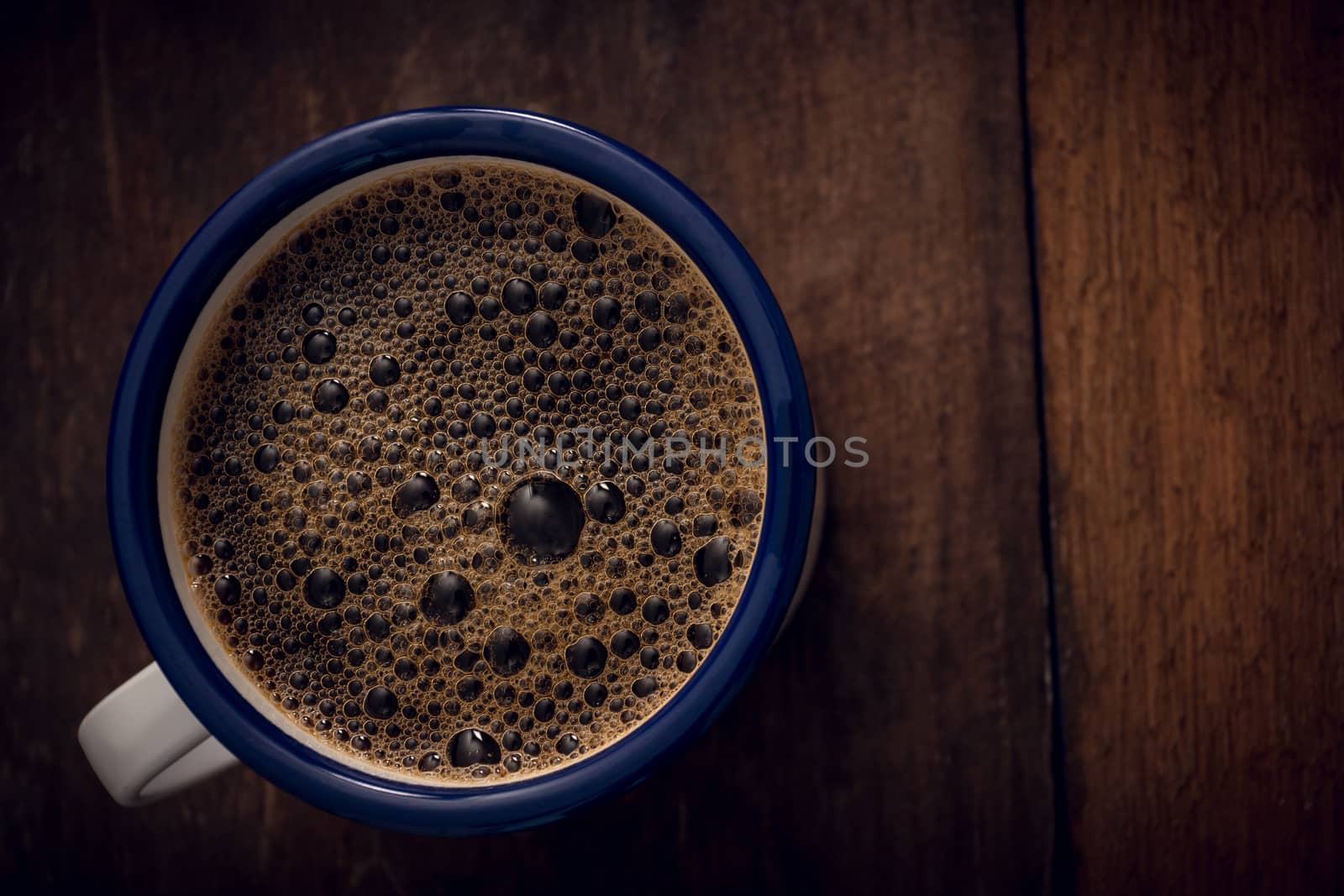 Cup of coffee on wooden background. Copy space. Top view. Flat lay