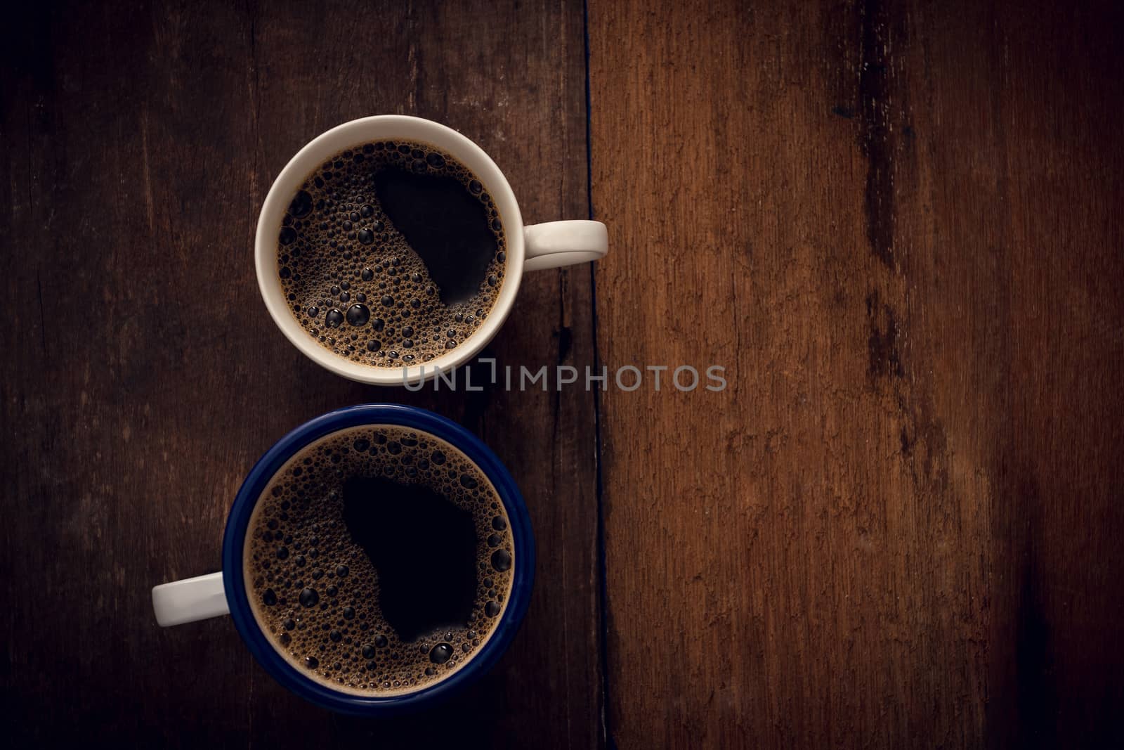 Cup of coffee on wooden background. Copy space. Top view. Flat lay