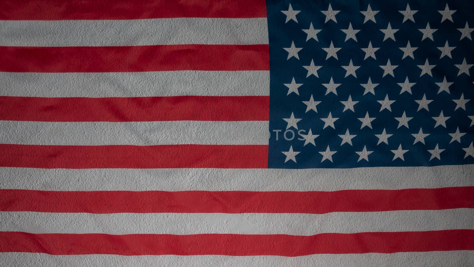 Abstract american flag on concrete cement wall, USA flag background with copy space. Top view