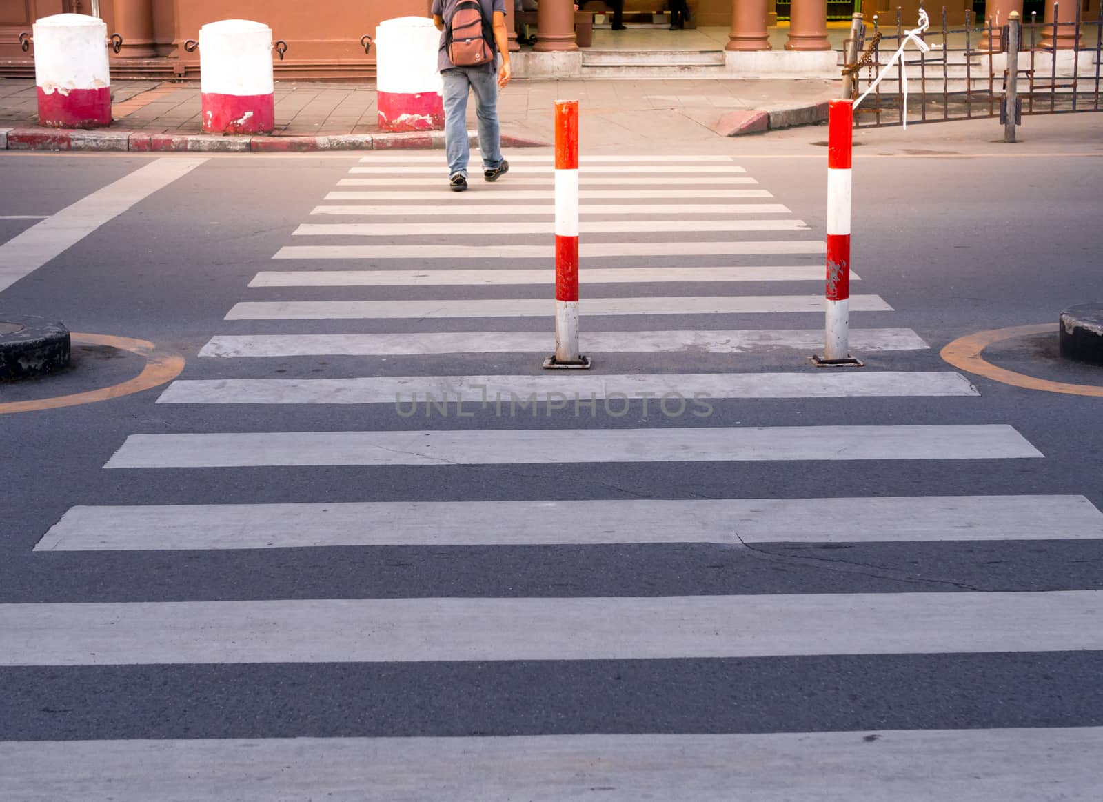 People cross the crosswalk