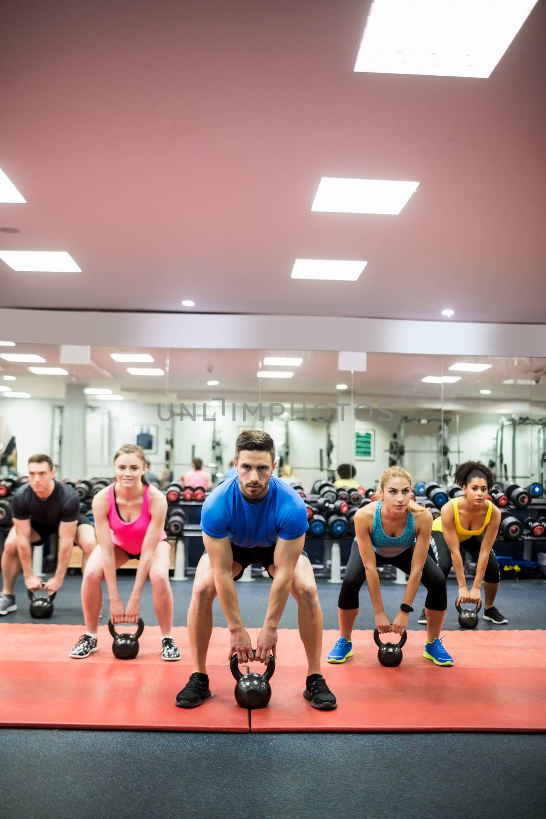 Fit people working out in fitness class by Wavebreakmedia