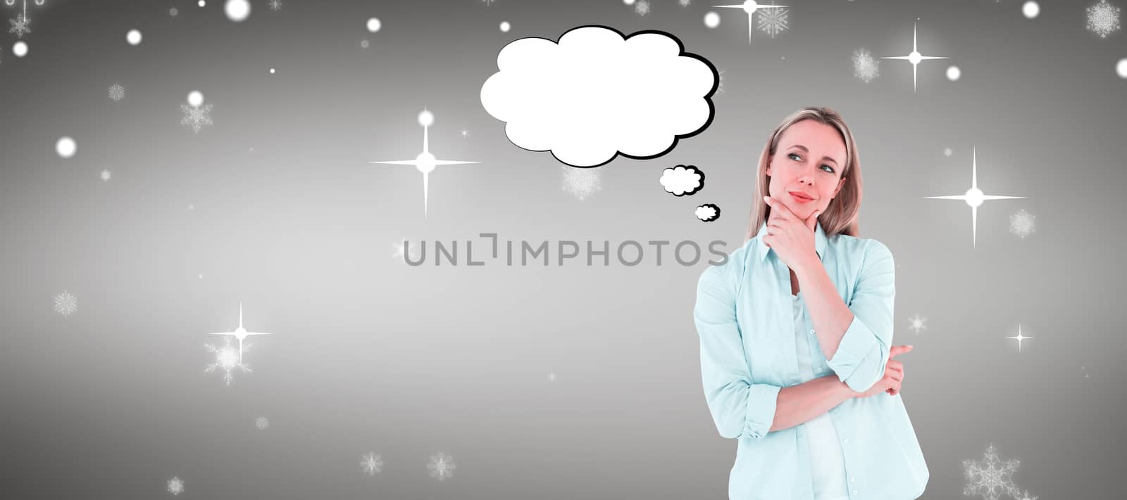 Pretty blonde thinking with hand on chin against grey vignette