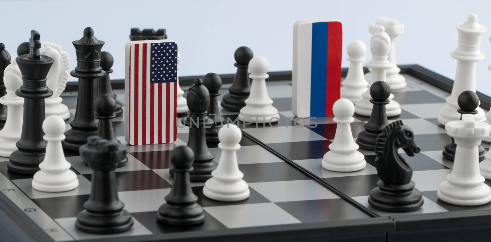 Symbols flag of Russia and the United States on the chessboard. The concept of political game.