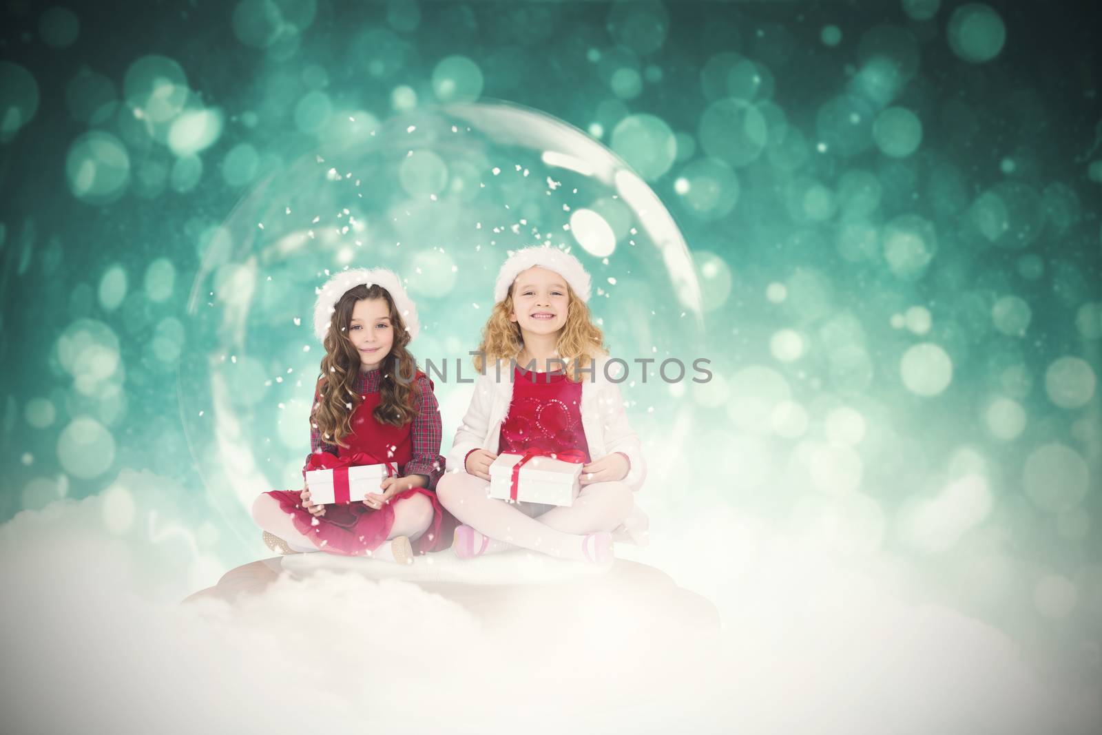 Composite image of festive child in snow globe by Wavebreakmedia