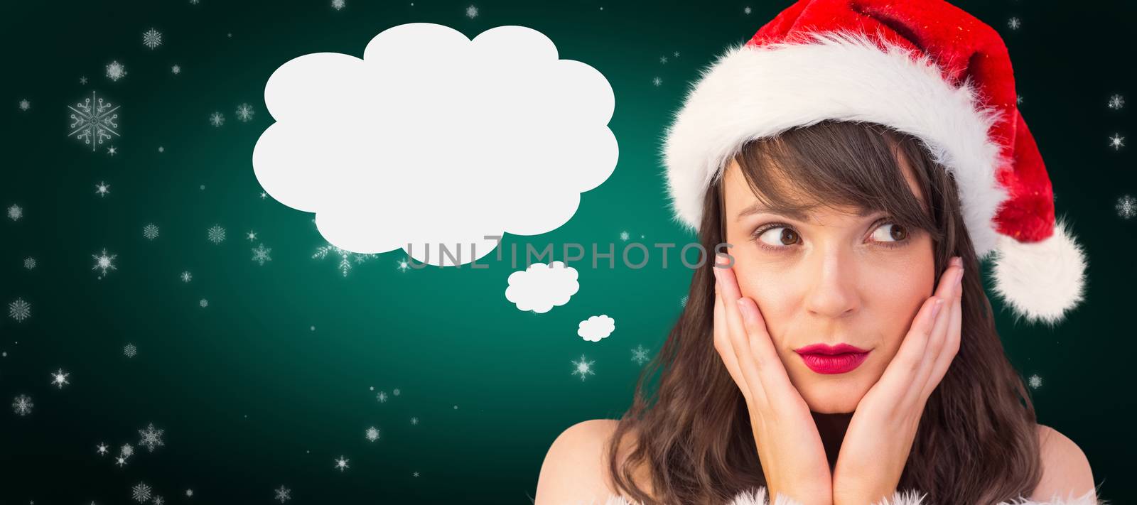 Pretty santa girl with hands on face against green background with vignette