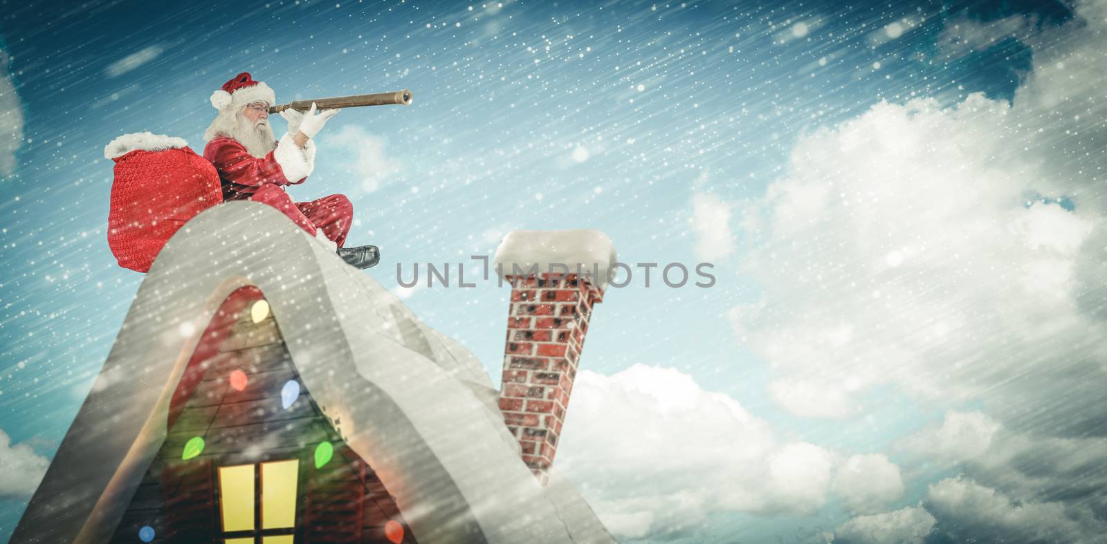 Santa sitting on roof of cottage against scenic view of blue sky