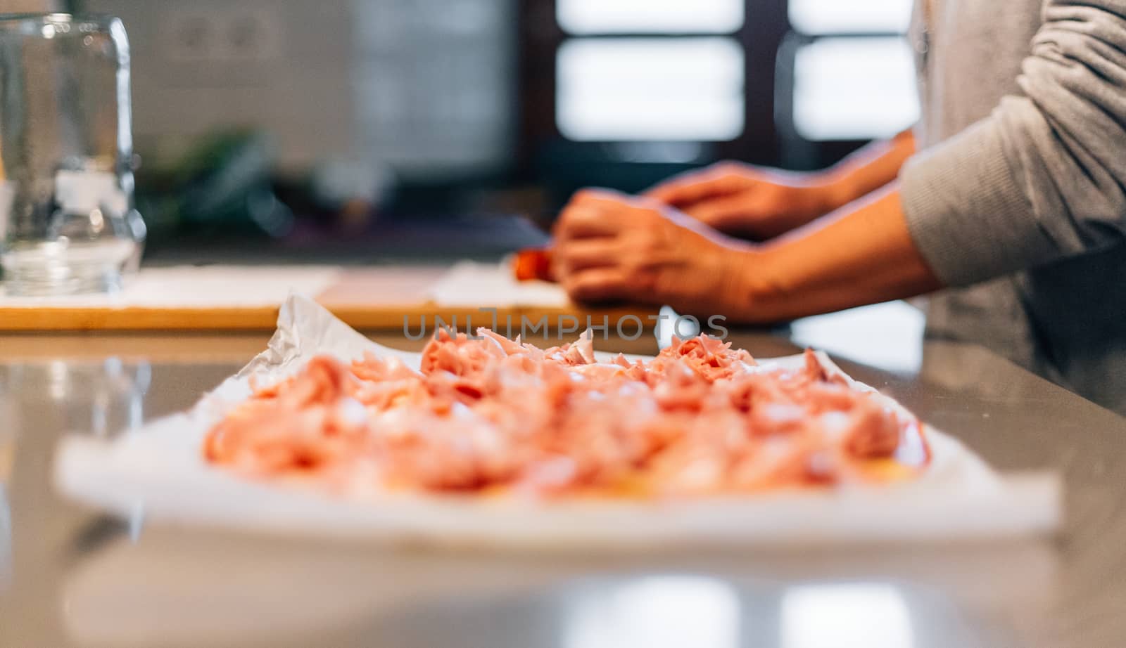 A person making a pizza by Daniel_Mato