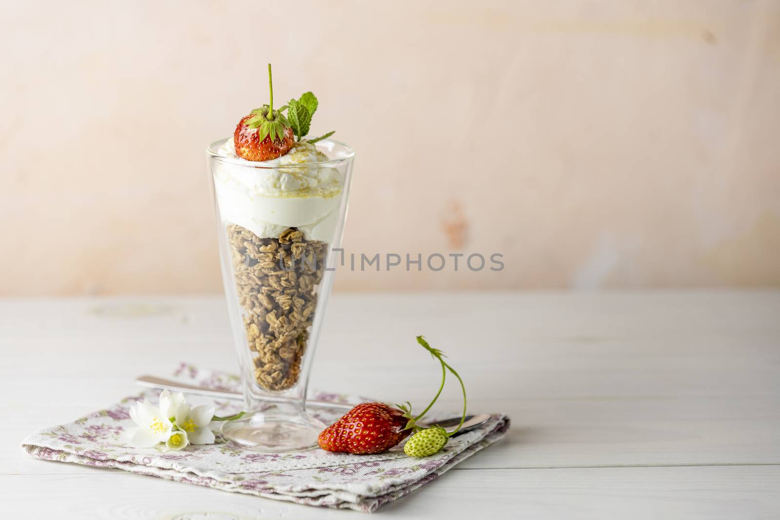 Glass of healthy breakfast with granola and greek yogurt close u by ArtSvitlyna