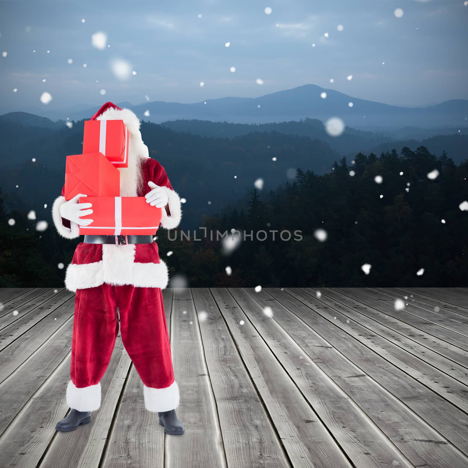 Composite image of santa carrying gifts by Wavebreakmedia