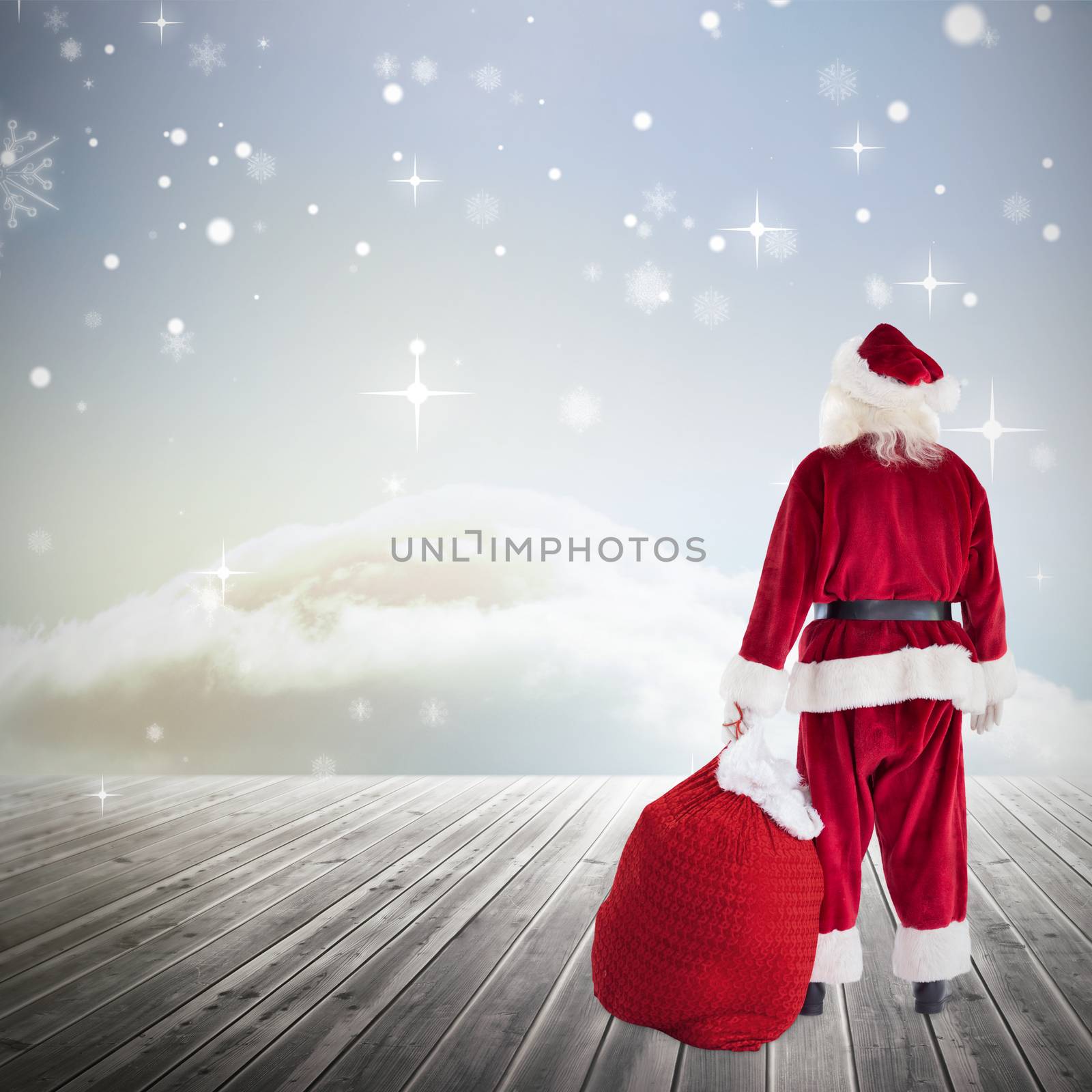 Composite image of santa with sack of gifts by Wavebreakmedia