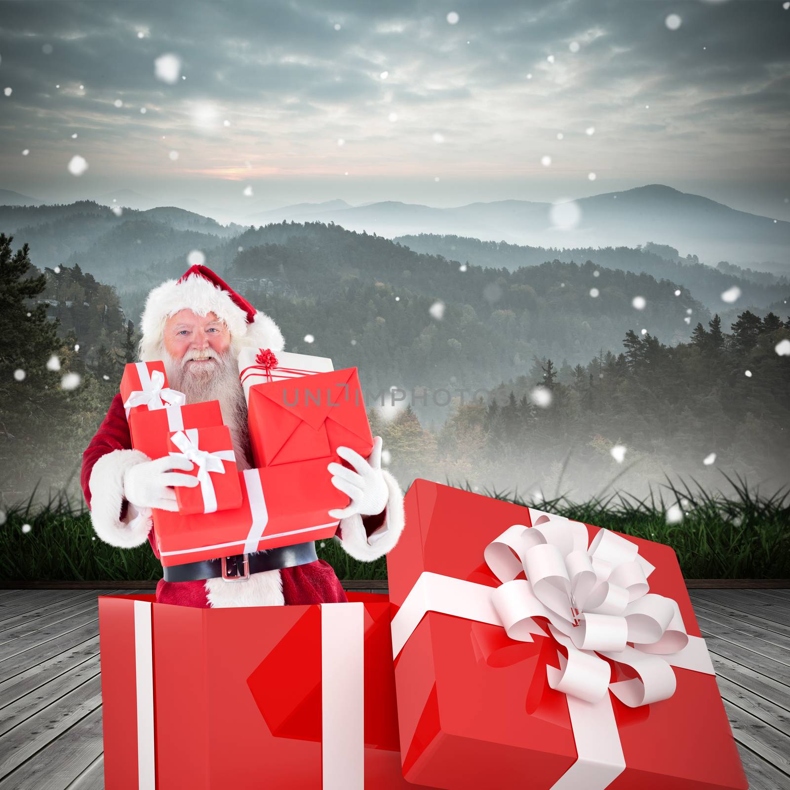 Composite image of santa standing in large gift by Wavebreakmedia