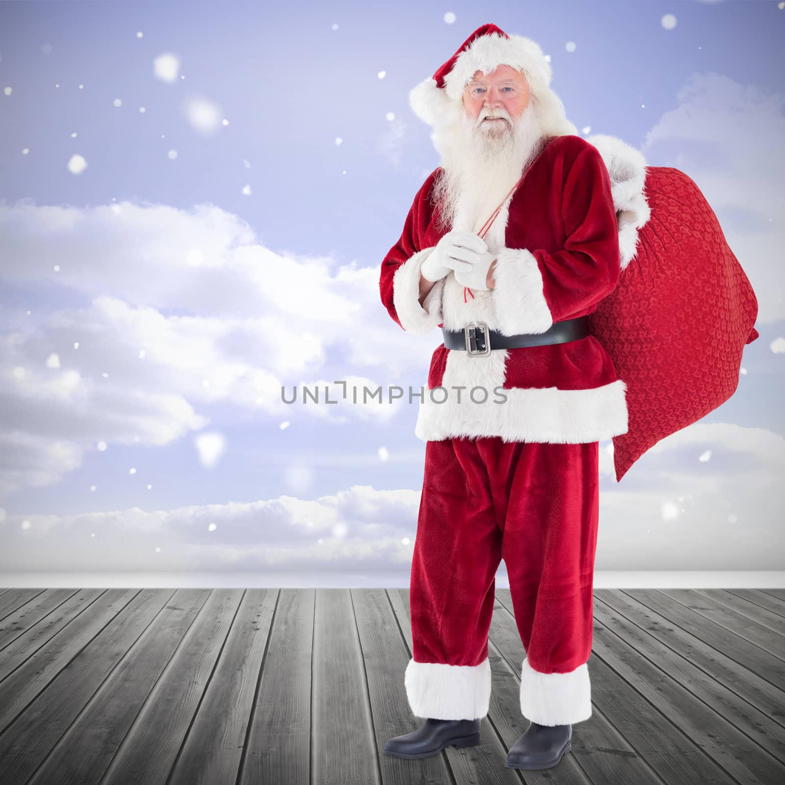 Composite image of santa smiling at camera by Wavebreakmedia