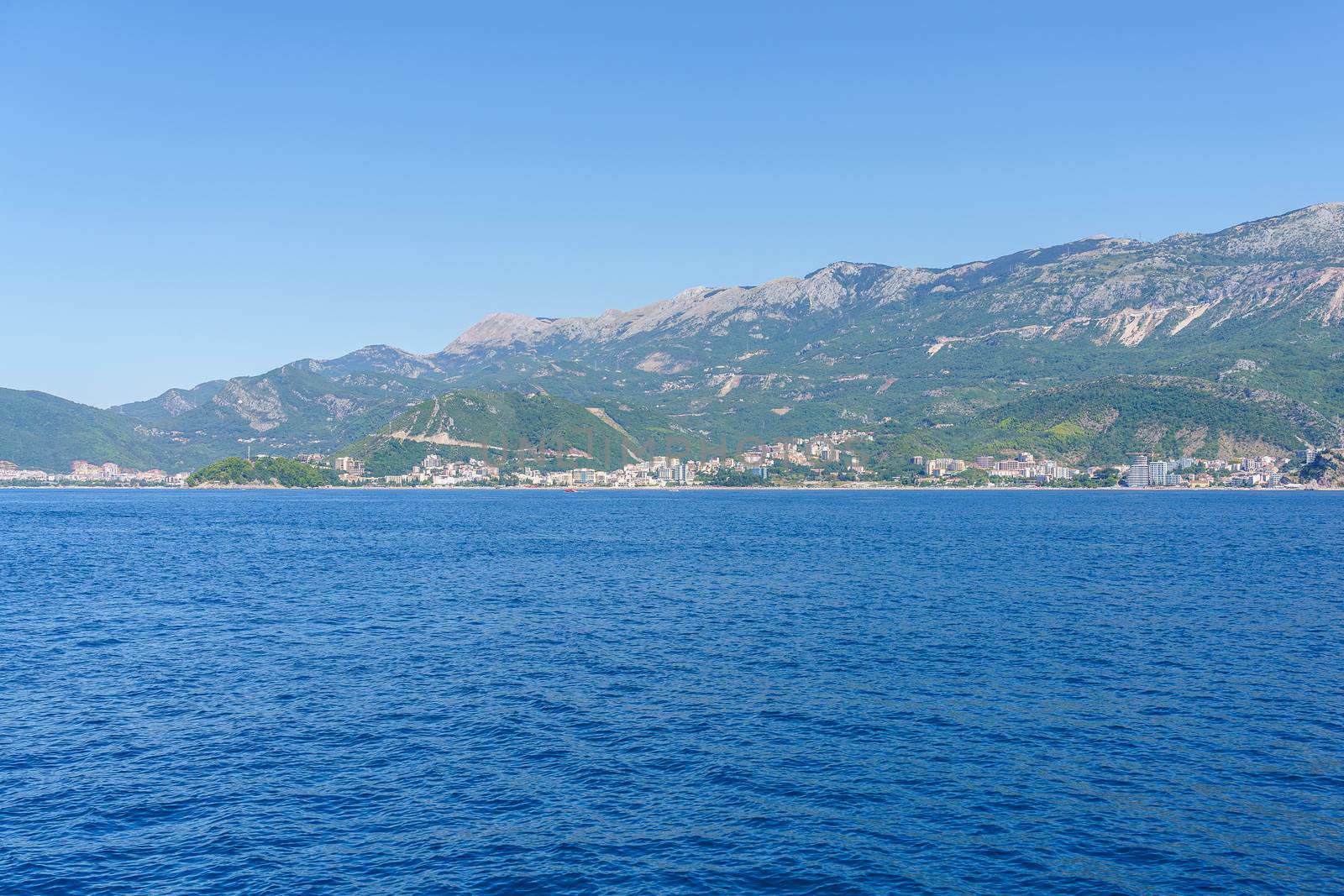 Budva Riviera in Montenegro, view from the sea on a sunny summer day