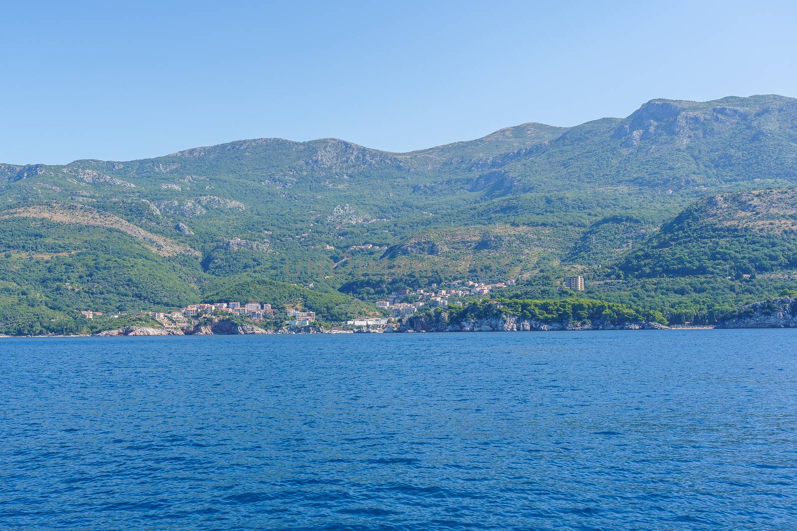 Budva Riviera in Montenegro, view from the sea on a sunny summer day