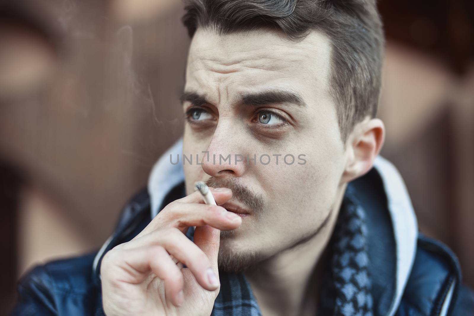 Man smoking cigarette Close up of an smoking cigarette