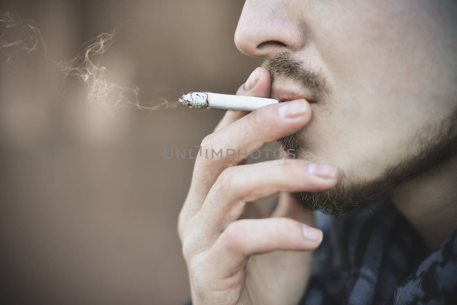 Man smoking cigarette Close up of an smoking cigarette