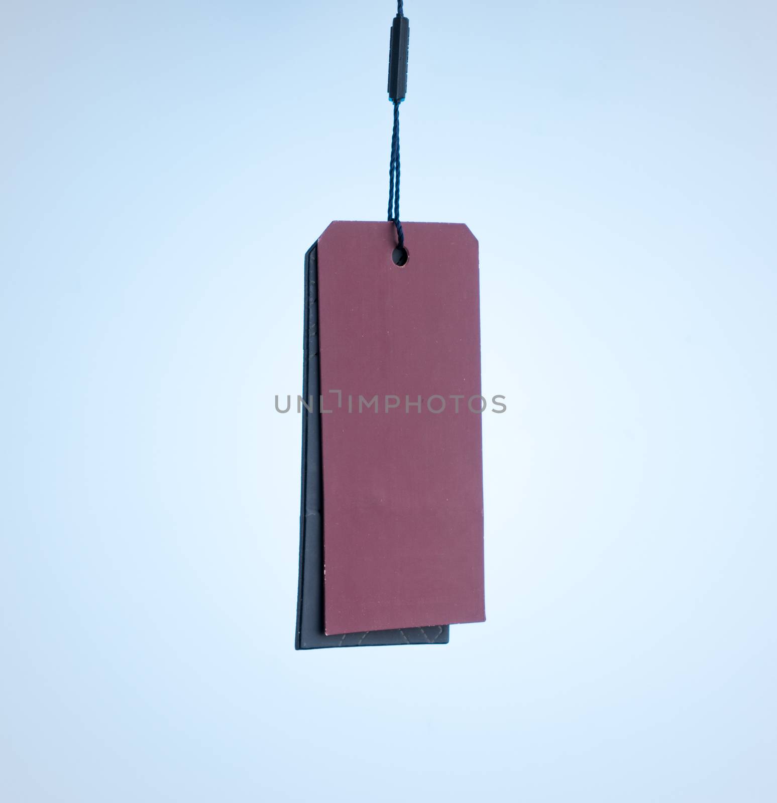 two price tags isolated on blue background, red and black