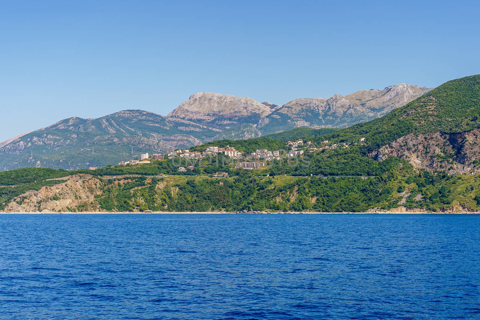 Budva Riviera in Montenegro, view from the sea on a sunny summer day