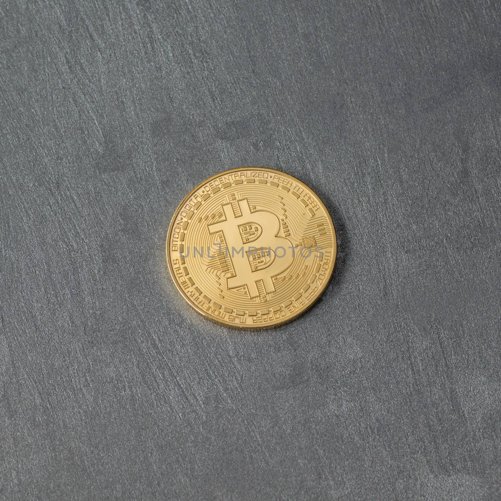 bitcoin on a plastered surface, top view. electronic money