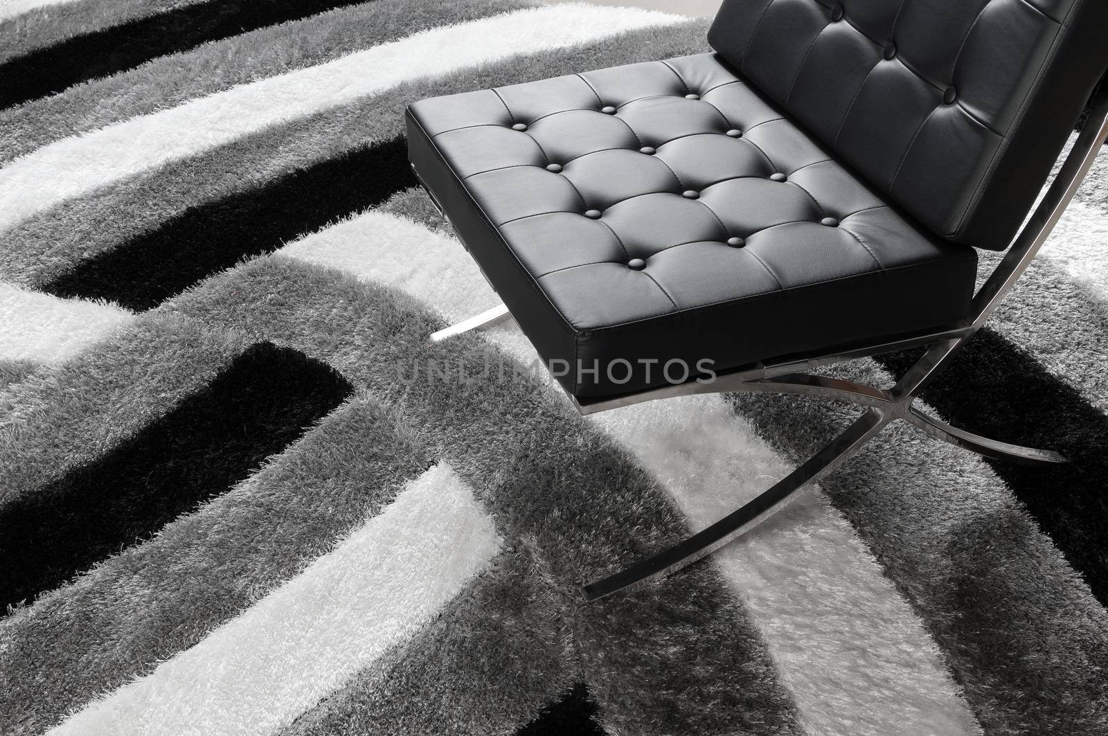modern soft chair on the carpet