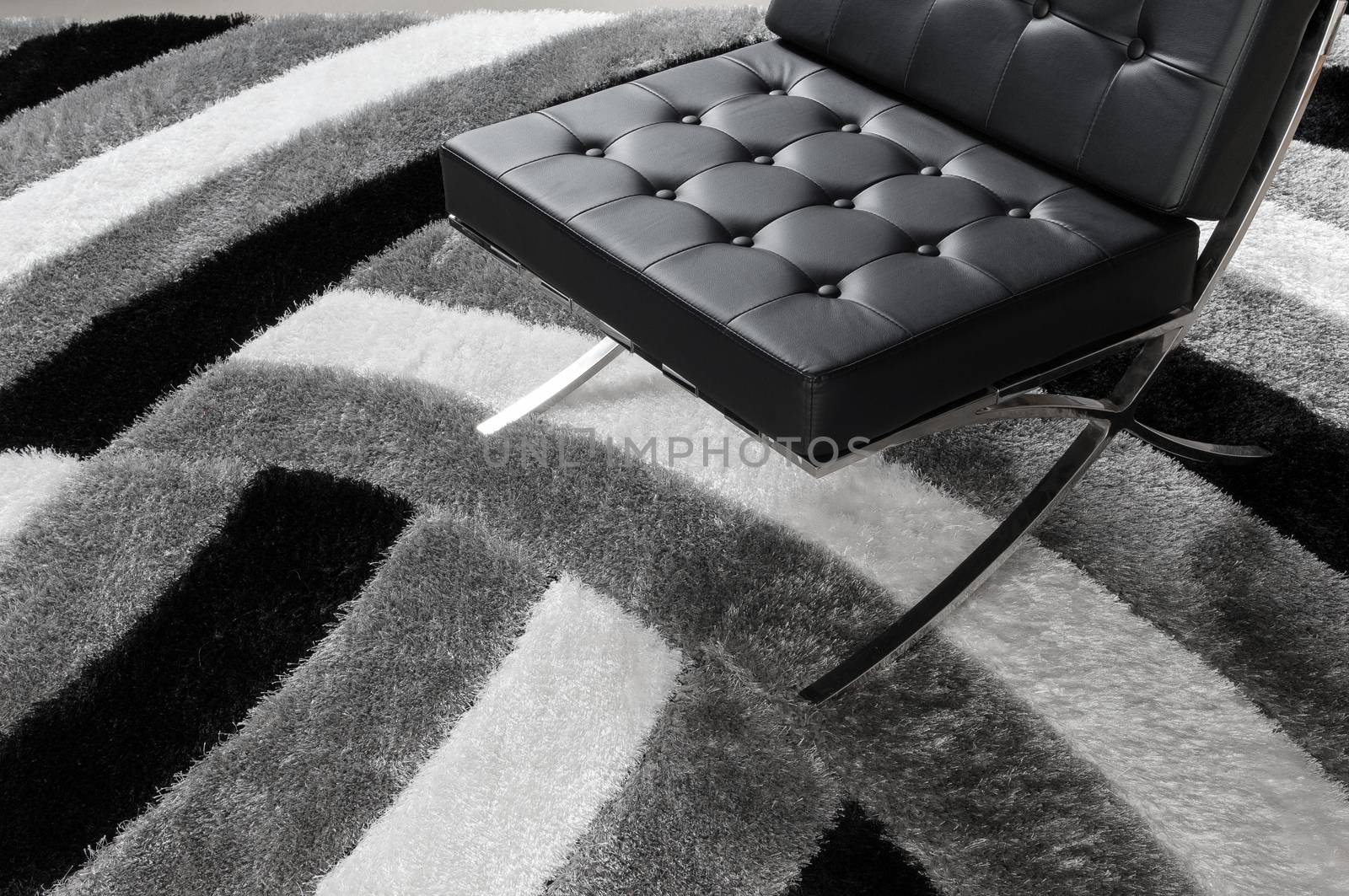 modern soft chair on the carpet
