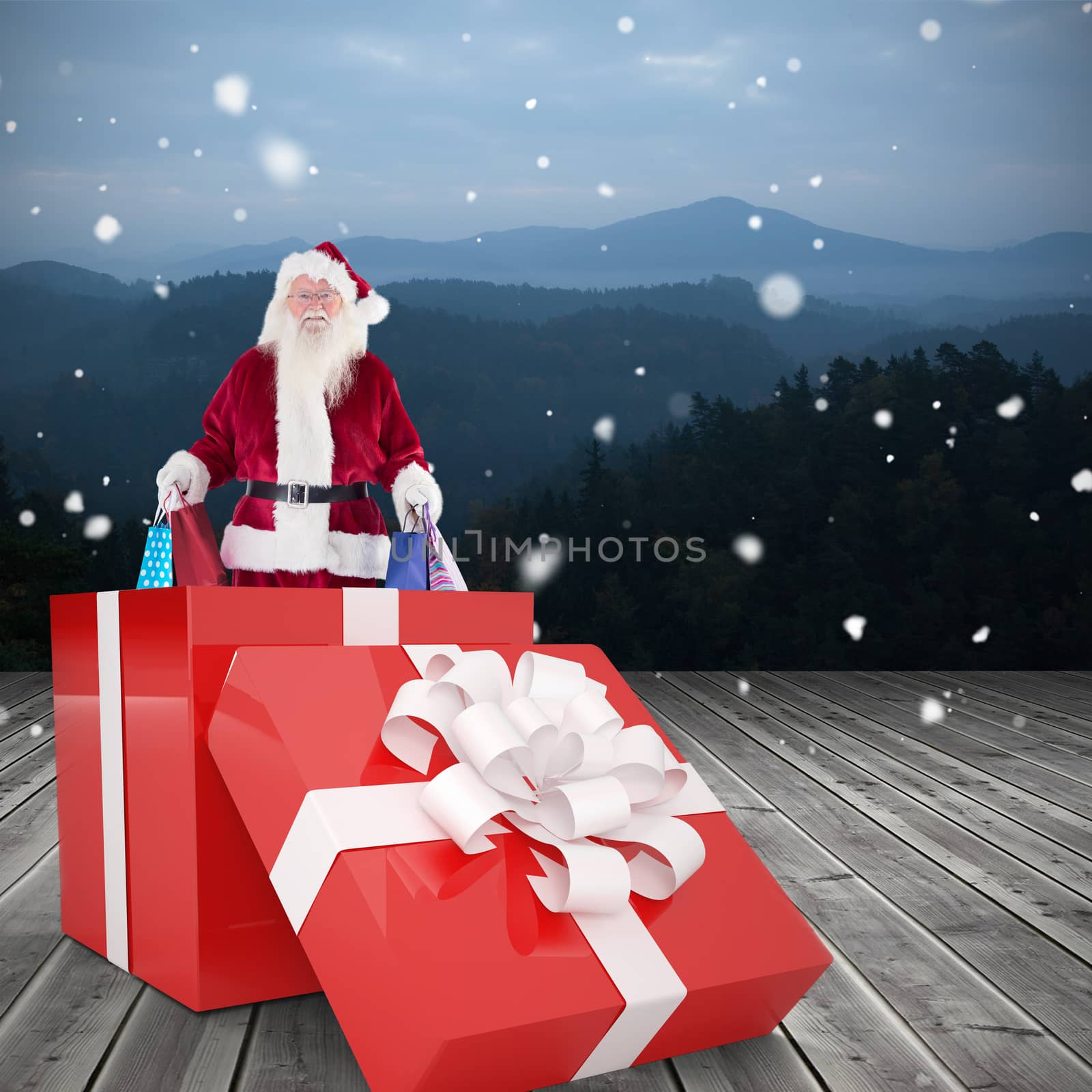 Santa standing in large gift against wooden planks against mountains