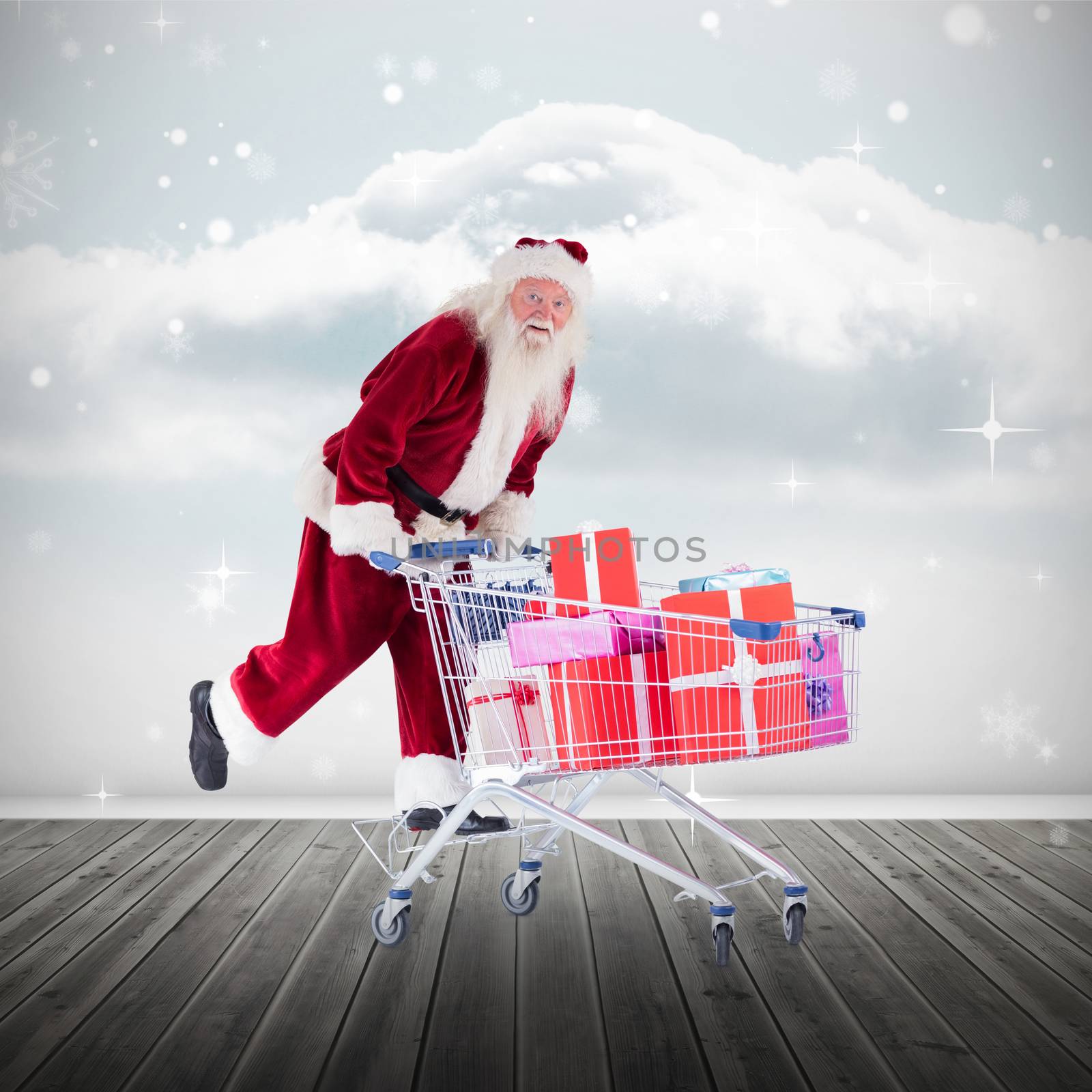 Composite image of santa pushing shopping cart by Wavebreakmedia