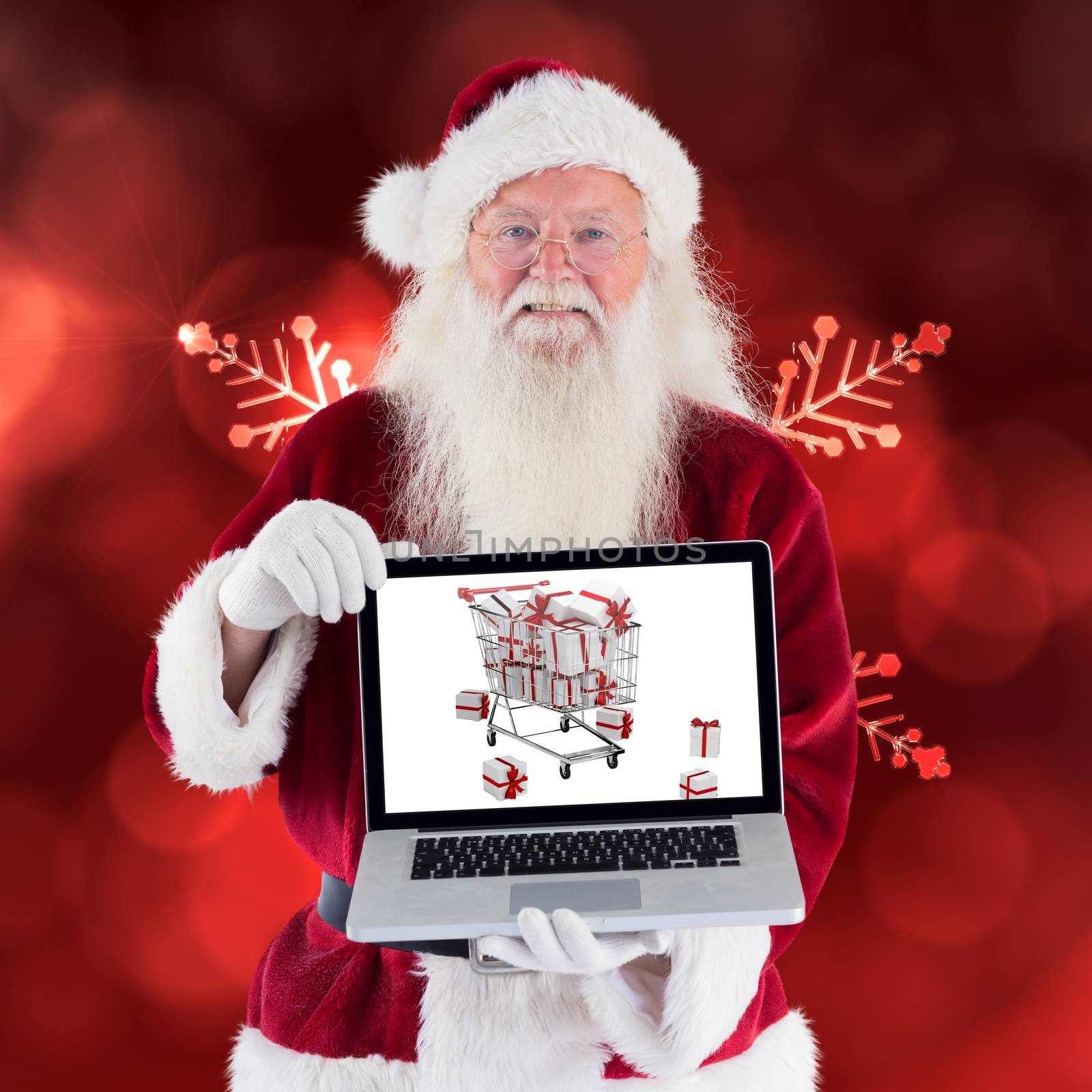 Composite image of santa claus presents a laptop by Wavebreakmedia