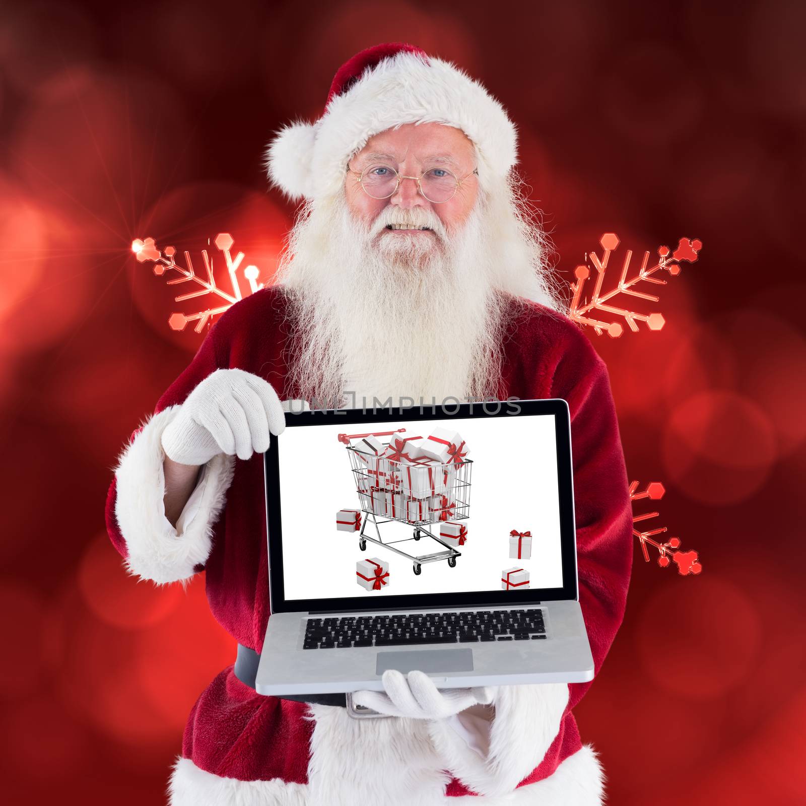 Santa Claus presents a laptop against red snow flake pattern design