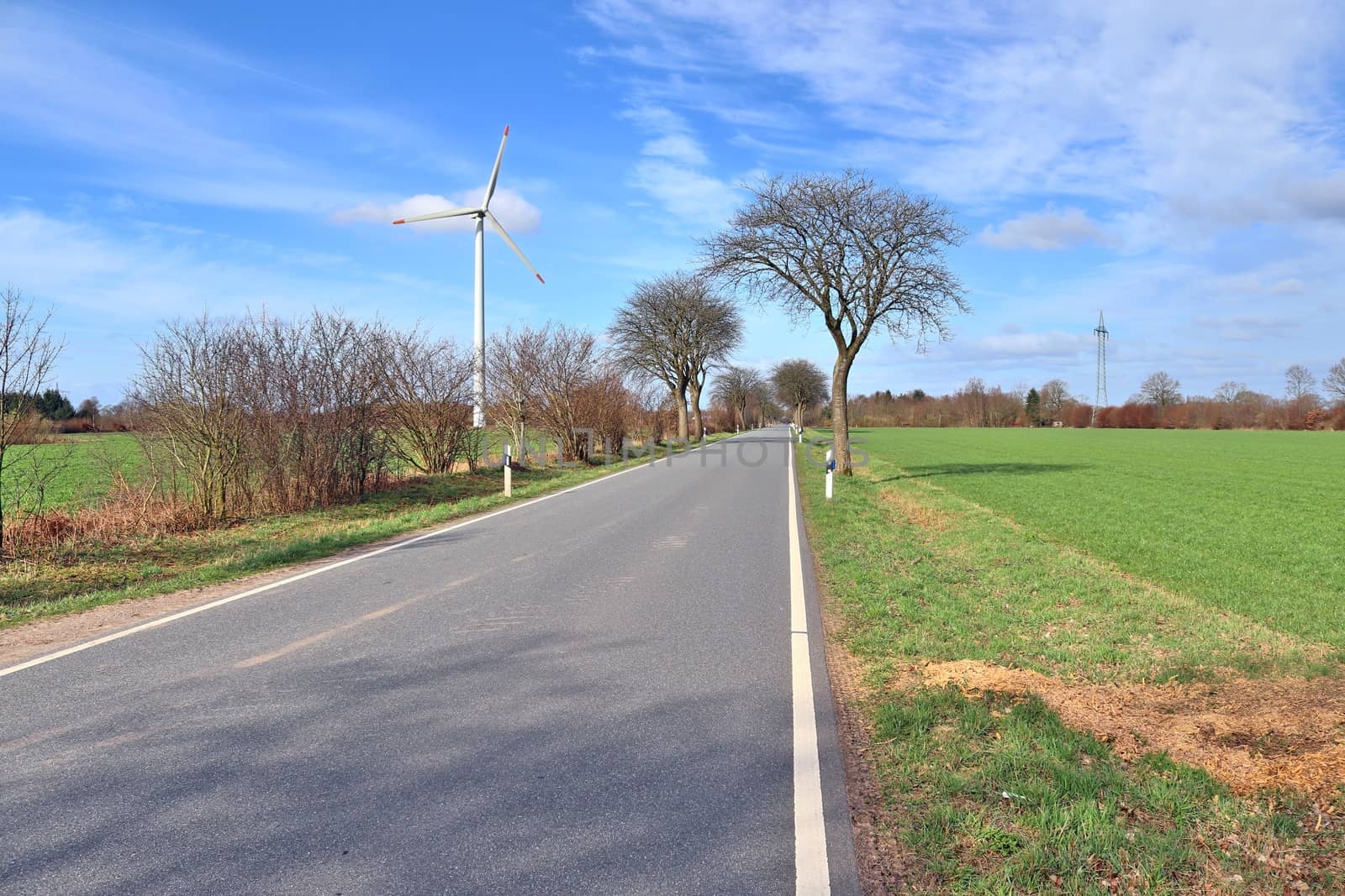 Beautiful view on countryside roads with fields and trees in northern europe.