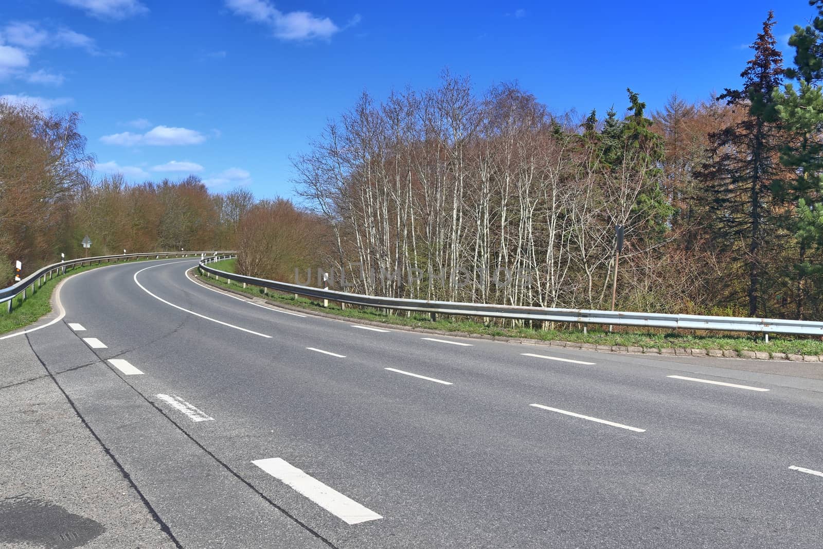 Beautiful view on countryside roads with fields and trees in northern europe.