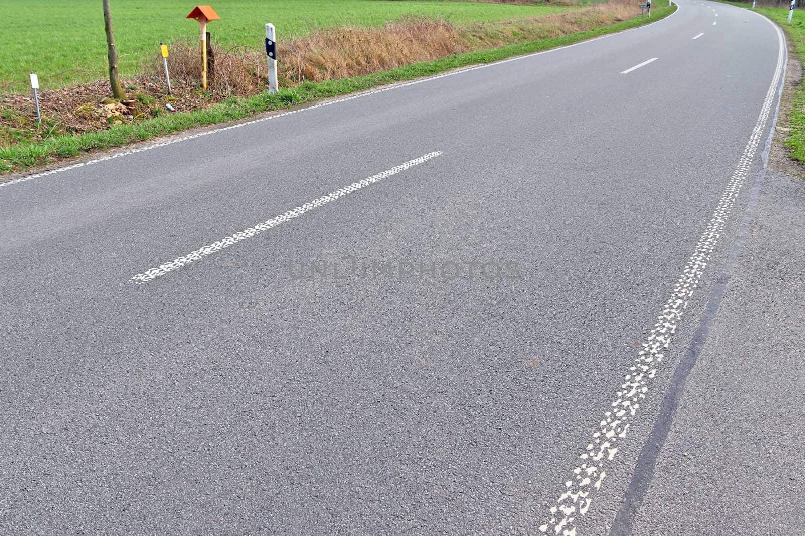 Beautiful view on countryside roads with fields and trees in northern europe.