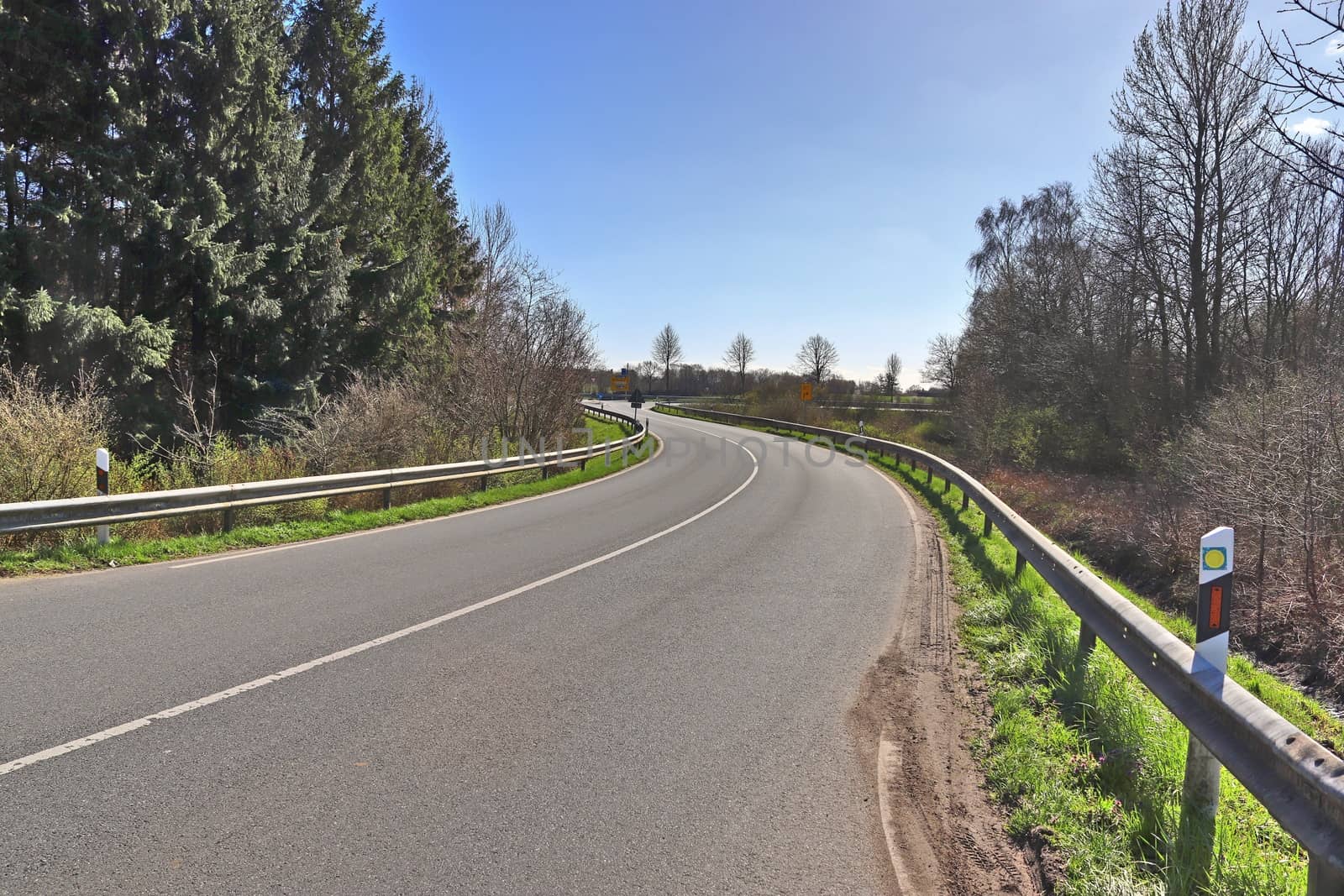 Beautiful view on countryside roads with fields and trees in northern europe.