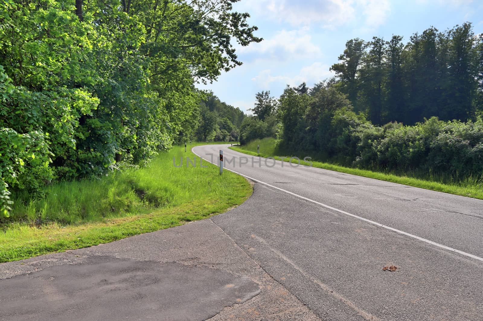 Beautiful view on countryside roads with fields and trees in northern europe.