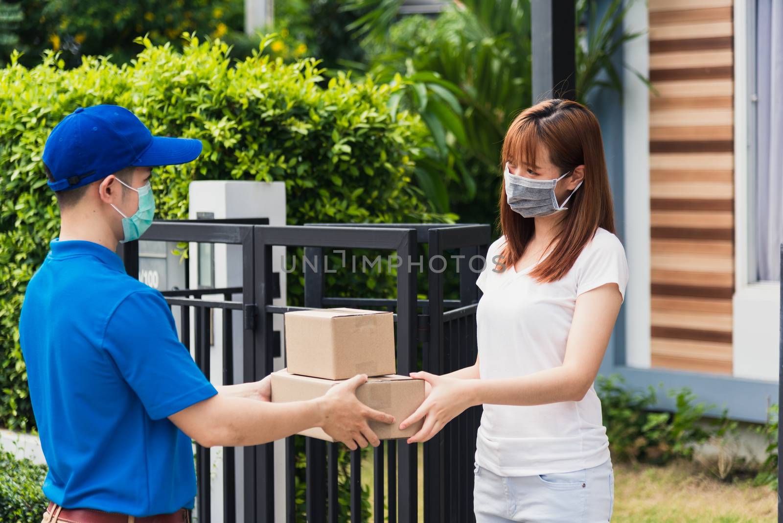 delivery man box he protective face mask service woman customer  by Sorapop