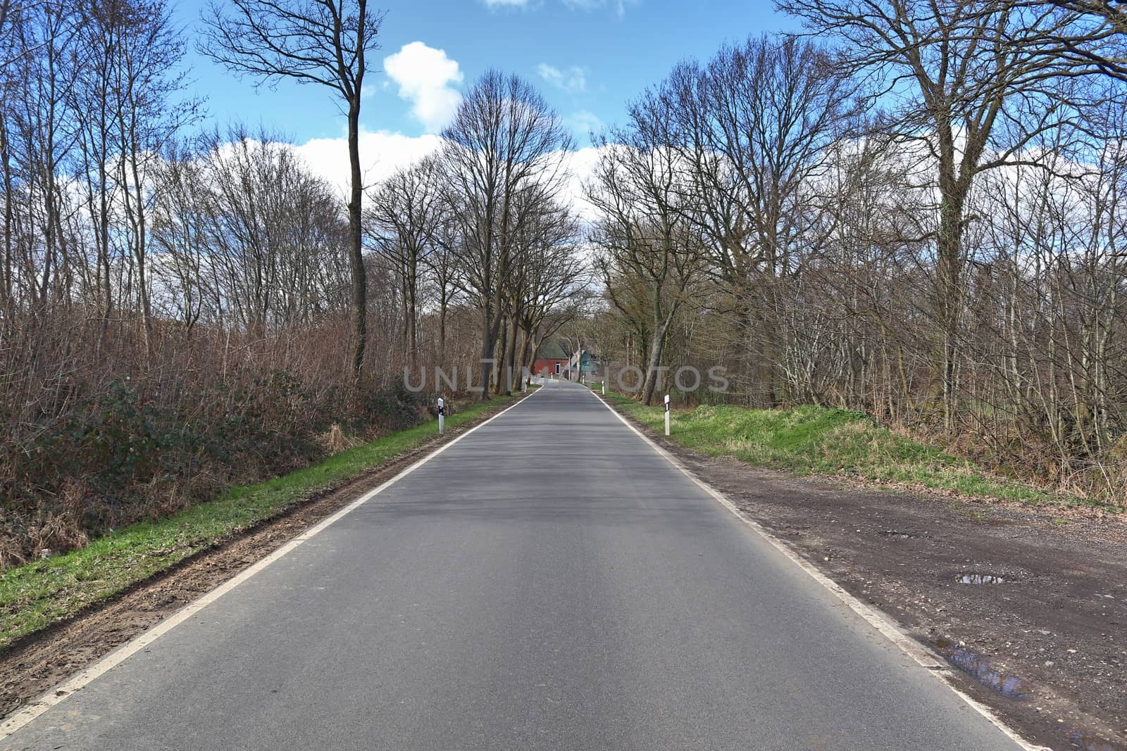 Beautiful view on countryside roads with fields and trees in northern europe.