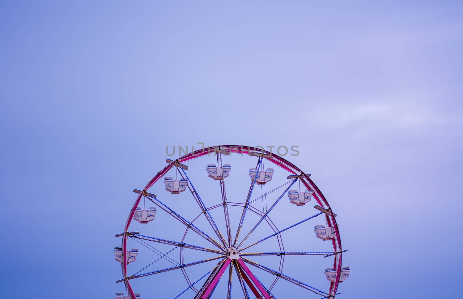 Ferris wheel against clear skyline by rushay