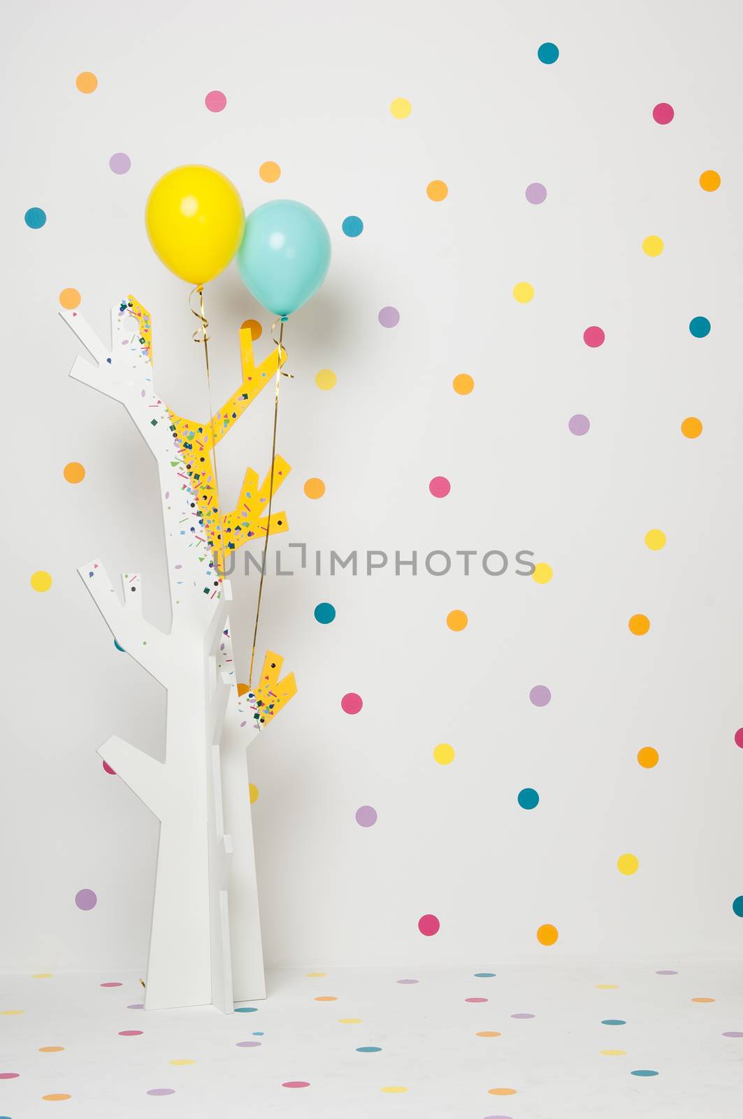 homemade baby beautiful wooden tree with balloons on a white background