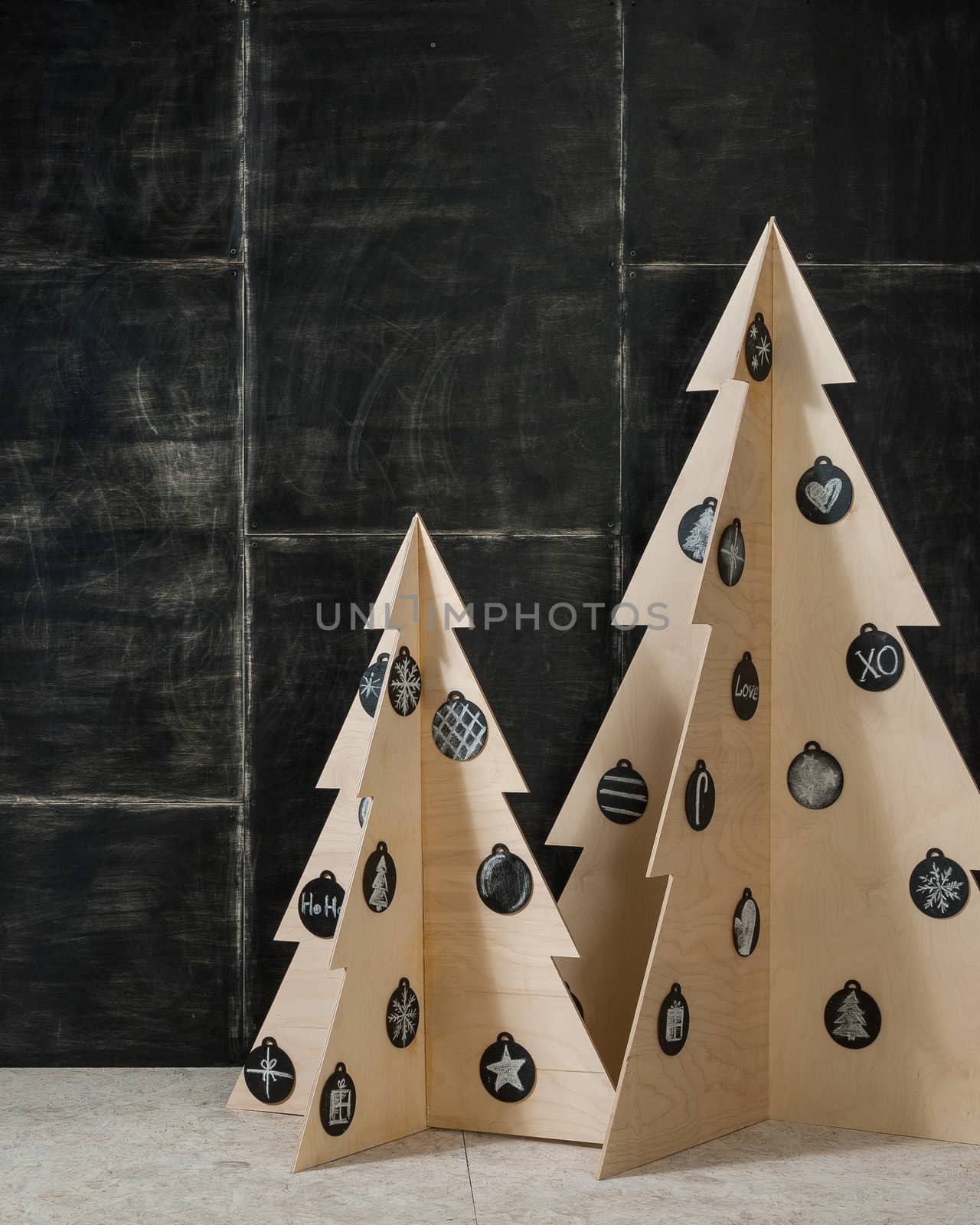 New Year's and Christmas decoration fir plywood and a tree on a dark background