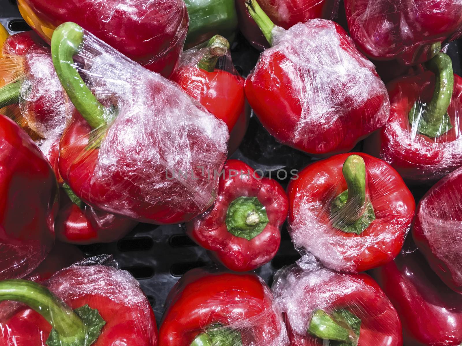 Bell pepper with plastic food wrap in the box