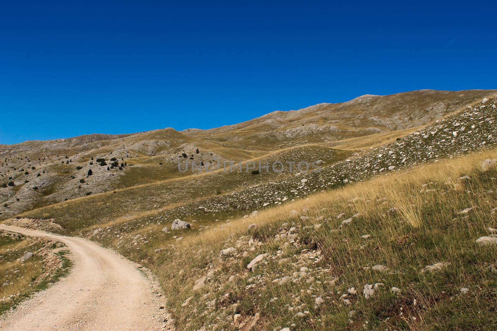 Mountain road on the mountain Bjelasnica, rocky landscape in autumn. Bjelasnica Mountain, Bosnia and Herzegovina.