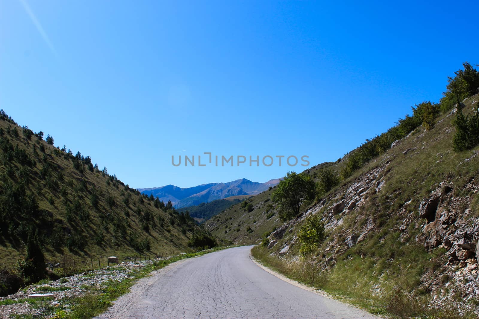 The road to the mountains. Mountains in the background. The road to the mountain Bjelasnica in Bosnia and Herzegovina. by mahirrov