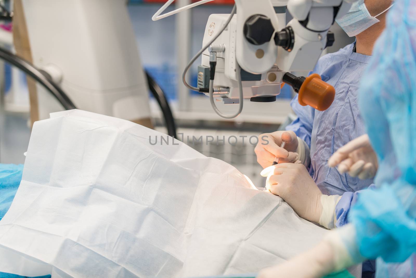 Doctors are in the process of conducting surgical operations on the eye. Closeup. medical concept