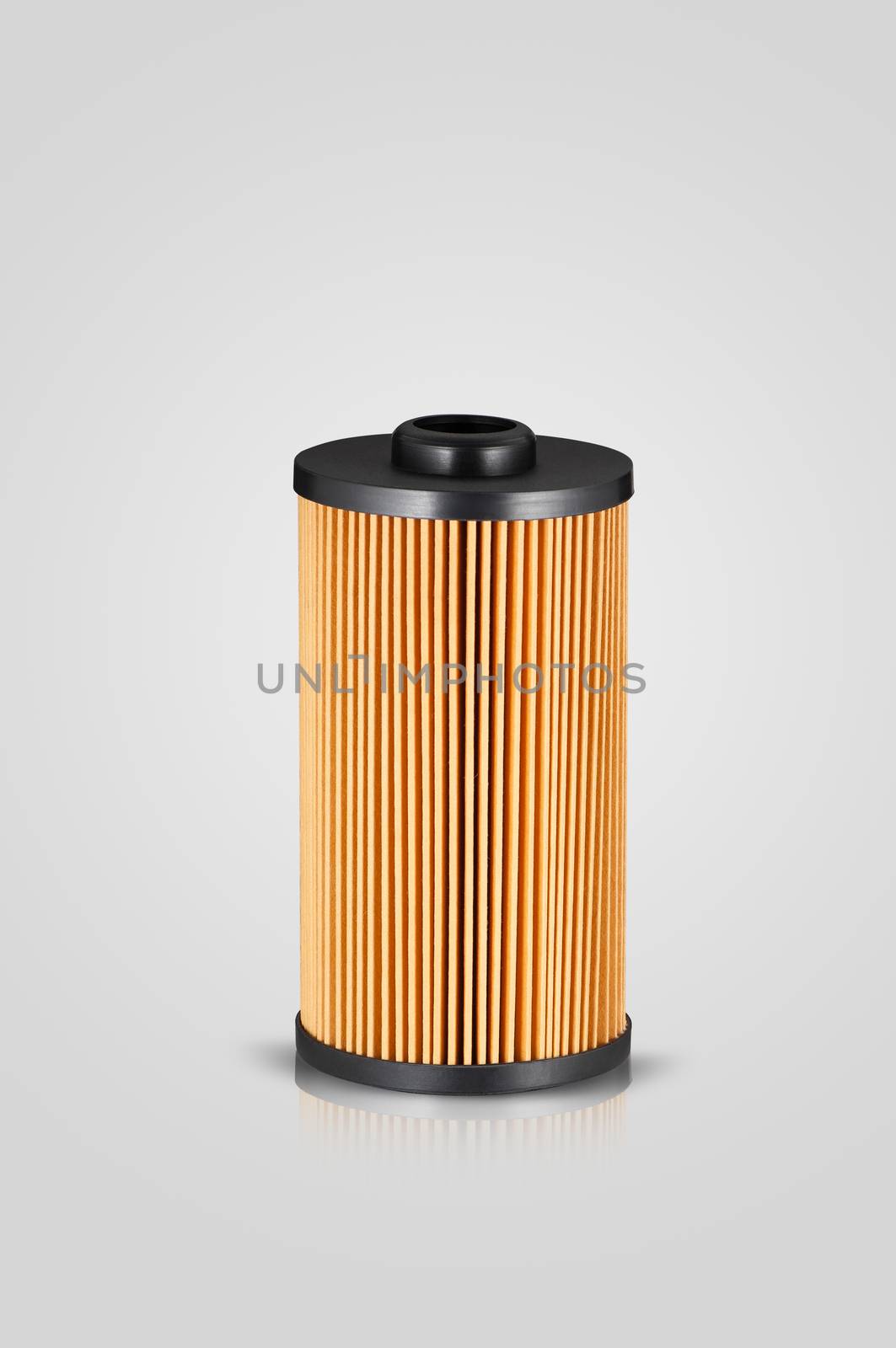 automotive filter cylindrical shape of orange color on a white background with reflection