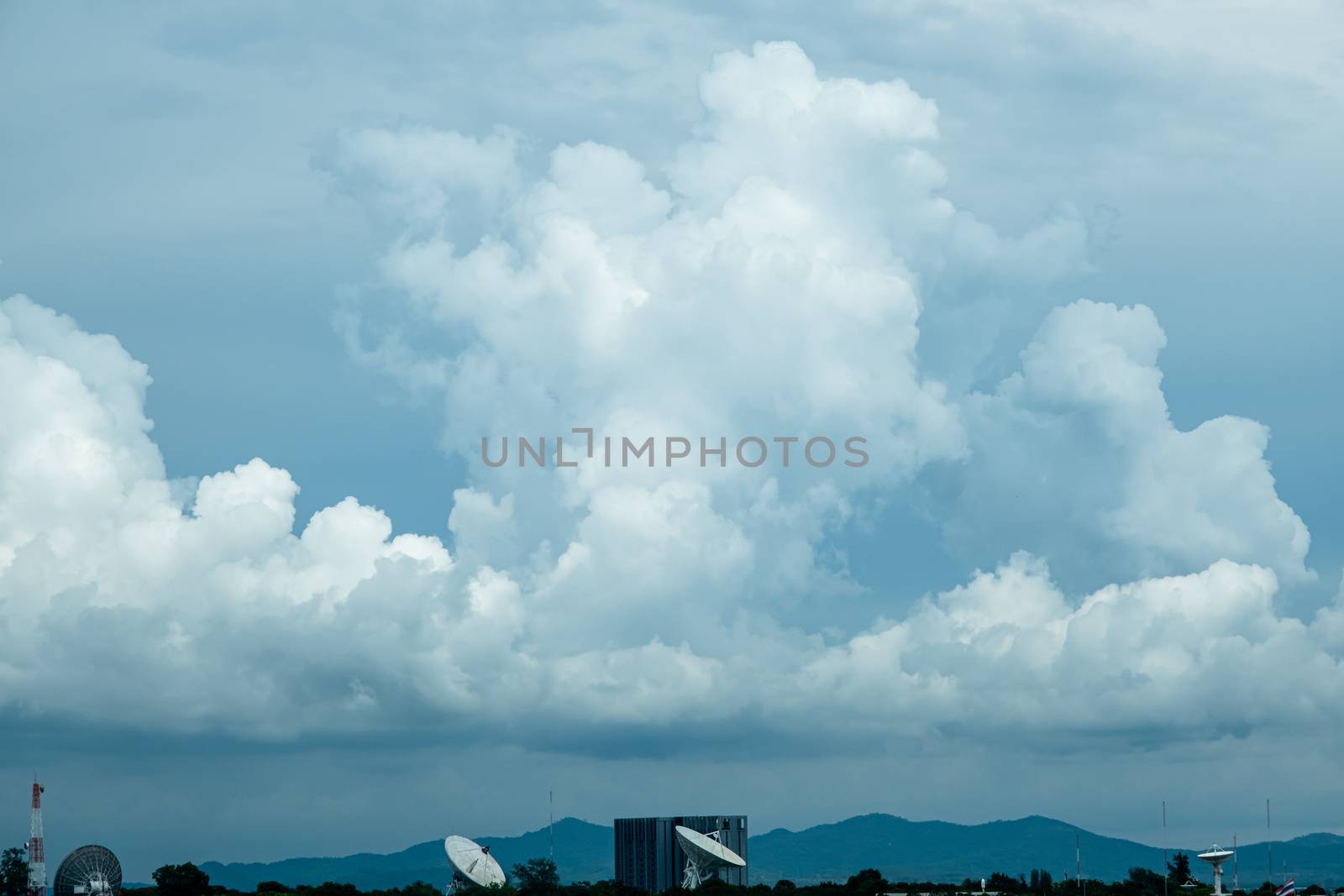 Photo of some white clouds and blue sky cloudscape for background use by peerapixs