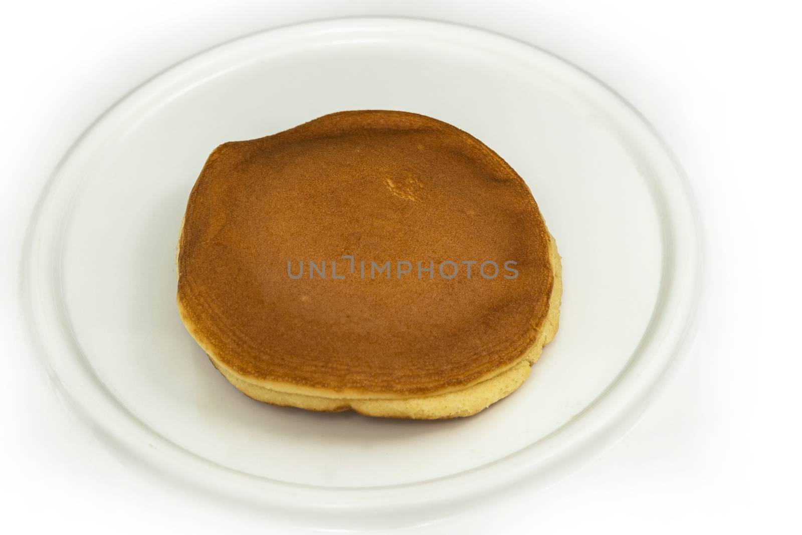 The Dorayaki , Japanese traditional red-bean pancake dessert on white plate