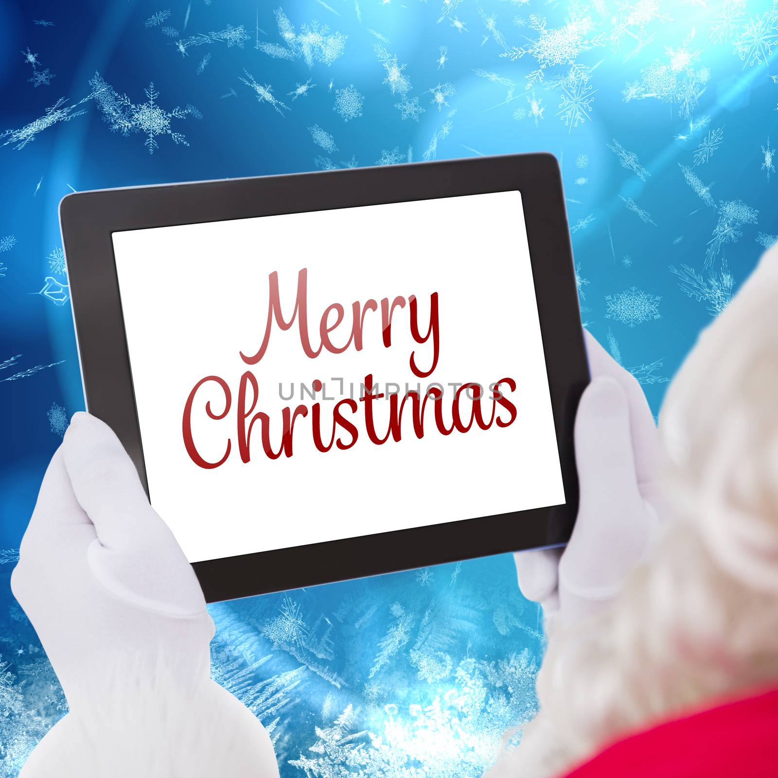 Santa claus using tablet pc against blue snow flake pattern design